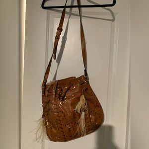 Brown leather bag with feathers never used